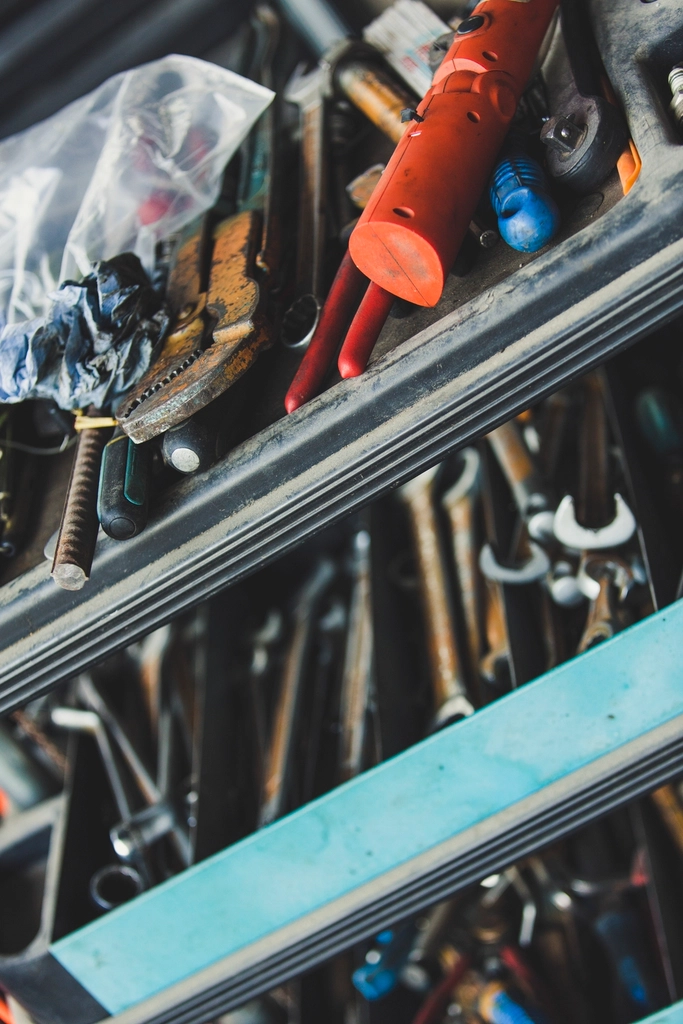 Assorted hand tools stored in a workshop tool chest