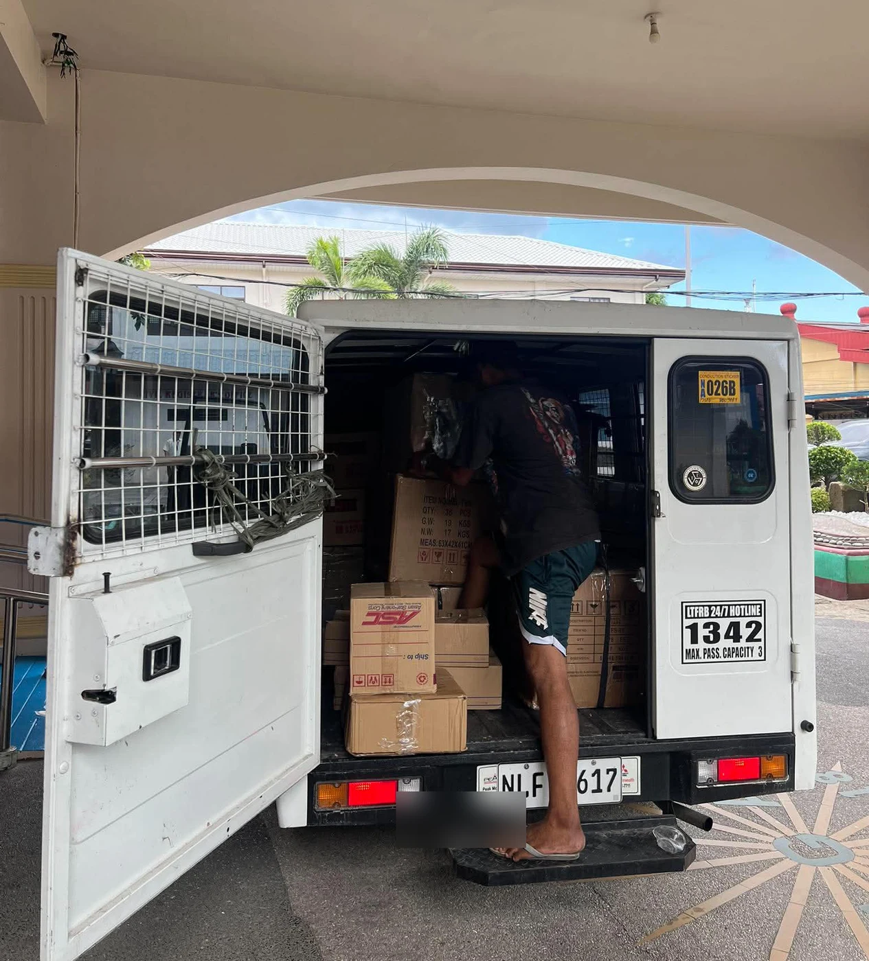 MR14 personnel actively unloading boxed goods from a delivery vehicle